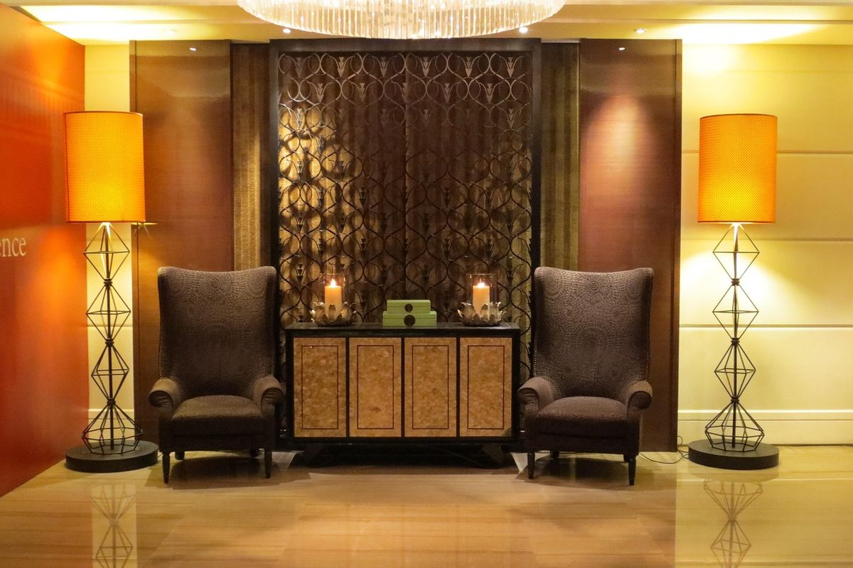 Dimly lit VIP lounge with velvet seating prepared for an exclusive evening